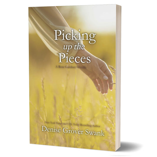 Book cover of 'Picking up the Pieces' by Denise Grover Swank with a hand reaching towards a field of yellow flowers.