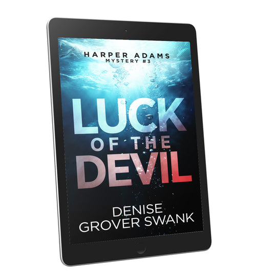 Ebook titled 'Luck of the Devil' by Denise Grover Swank displayed on a tablet.