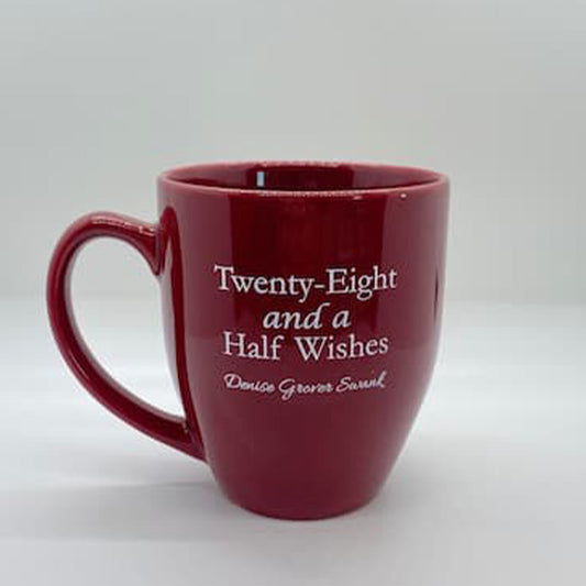 Red mug with white text on a white background